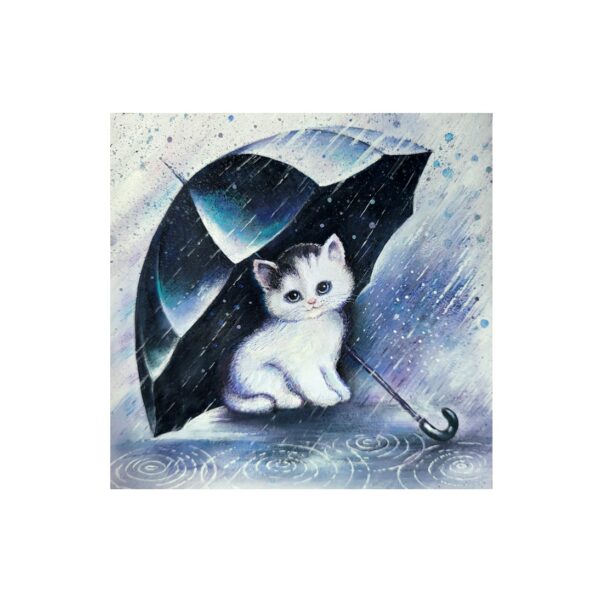 Magnet of a white kitten sitting under a black umbrella in the rain with puddles and raindrops around.