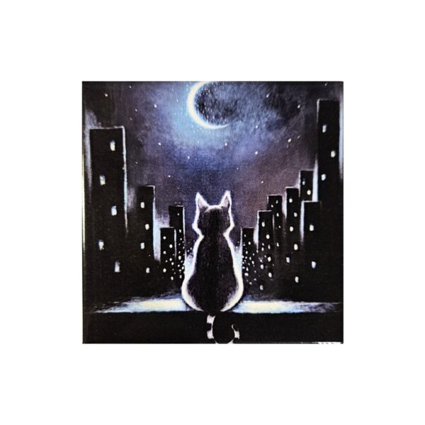 Magnet of a cat sitting on a rooftop at night, looking at a crescent moon above a glowing city skyline.