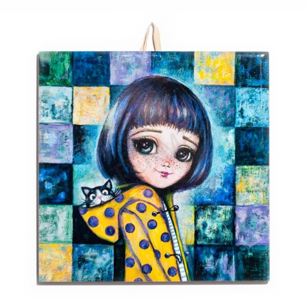 Ceramic tile painting of a girl with dark hair in a yellow polka-dot coat with a cat in her hood, set against a colorful checkered background.