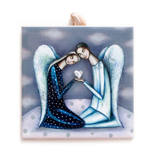 Ceramic tile featuring two stylized angels with wings, gently leaning their heads together while holding a white heart in their hands against a soft, cloudy background. Includes cork backing and a built-in hook for hanging.