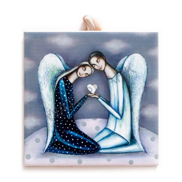 Ceramic tile featuring two stylized angels with wings, gently leaning their heads together while holding a white heart in their hands against a soft, cloudy background. Includes cork backing and a built-in hook for hanging.