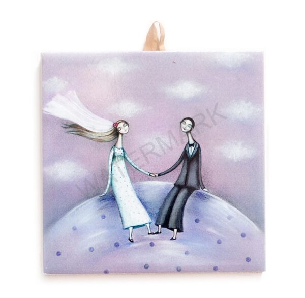 Ceramic tile artwork of a couple holding hands on a hill under a lavender sky with clouds.