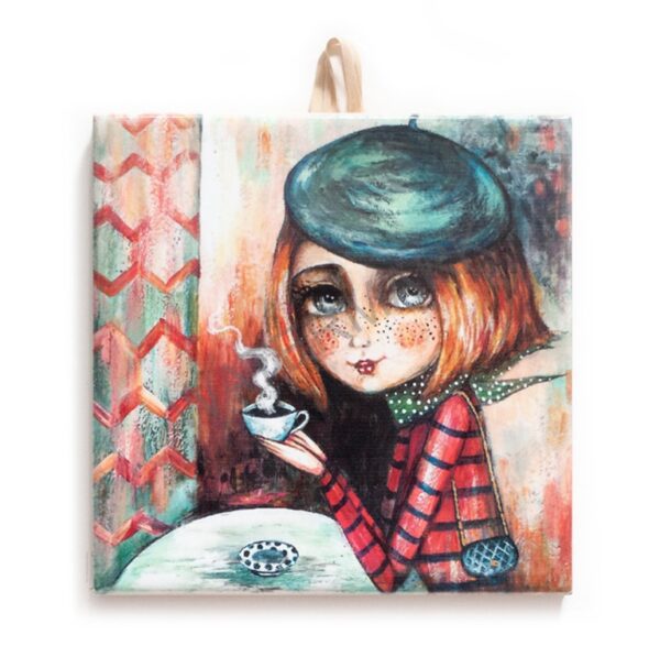 Colorful ceramic tile illustration of a whimsical girl with a beret and freckles, holding a steaming cup of coffee at a café table, set against a painterly background.