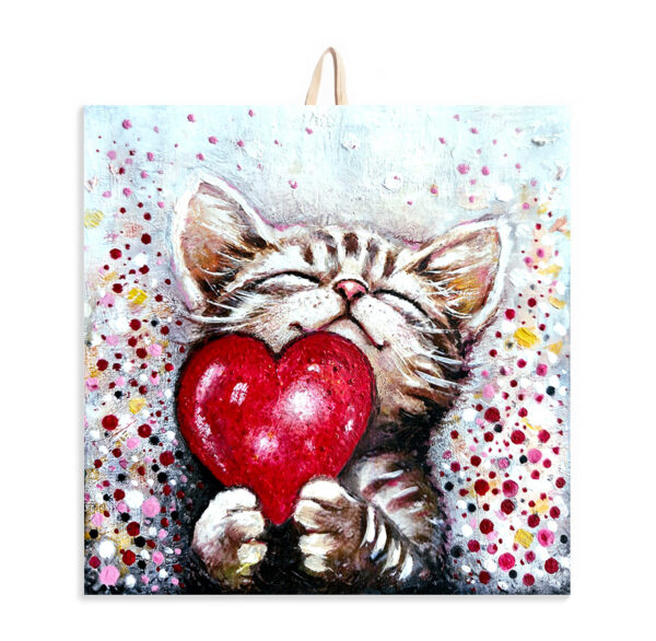 Ceramic tile painting of a smiling kitten holding a red heart, with colorful dotted background and cork backing for safe wall hanging.