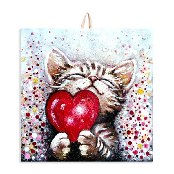 Ceramic tile painting of a smiling kitten holding a red heart, with colorful dotted background and cork backing for safe wall hanging.