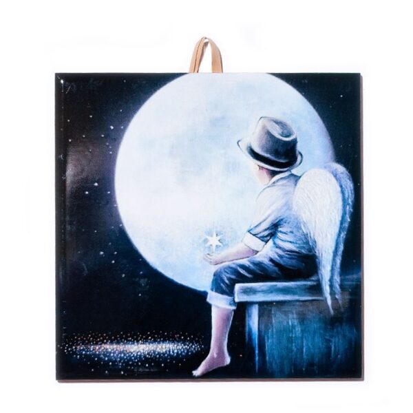 Ceramic tile showing a boy with angel wings and a hat, sitting on a bench and gazing at a large full moon, holding a glowing star in his hand.