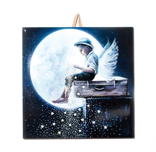 Ceramic tile with artwork of a boy angel sitting on a suitcase in front of a large moon, sprinkling stars into the night sky.